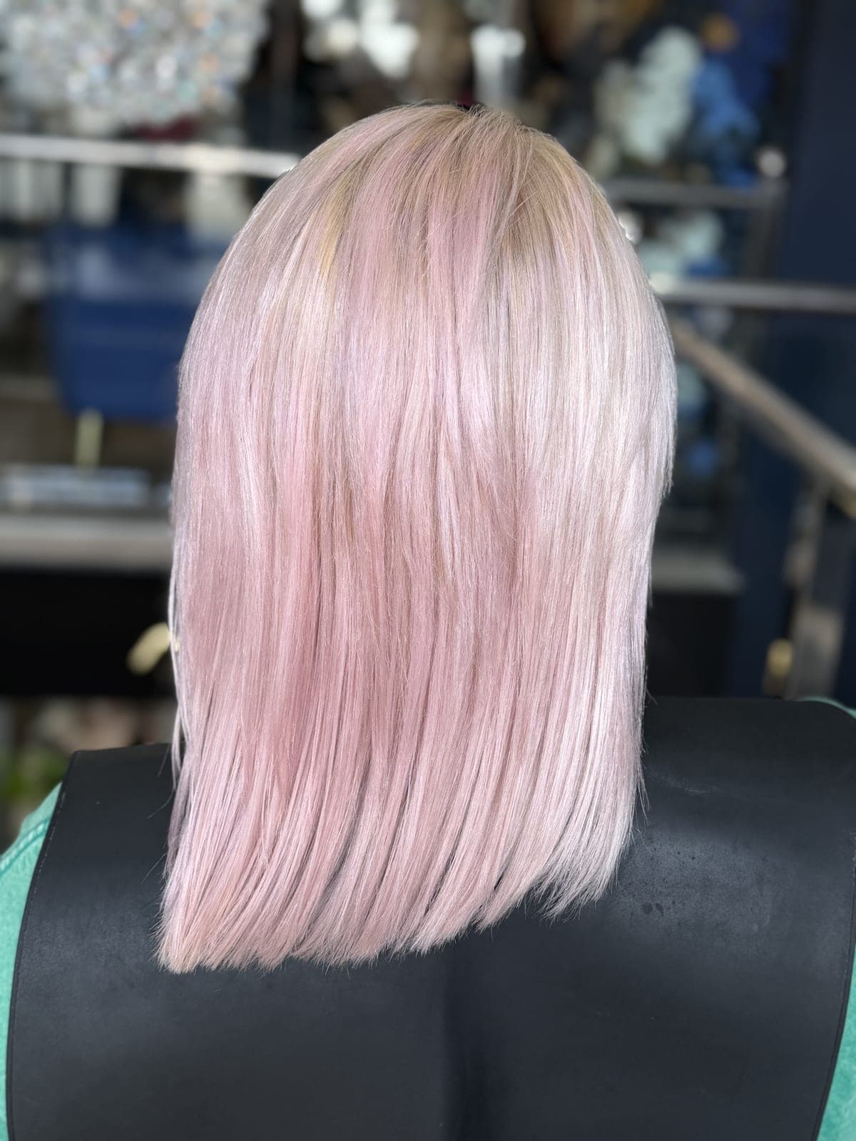Pastel pink color on a straight, sharply cut lob, seen from the back